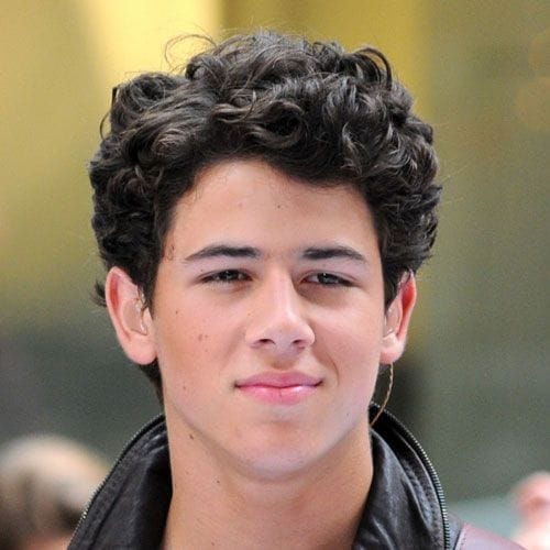The Best 7 Nick Jonas Haircuts for Your Next Party 6 6. Nick Jonas Long Curly Haircut