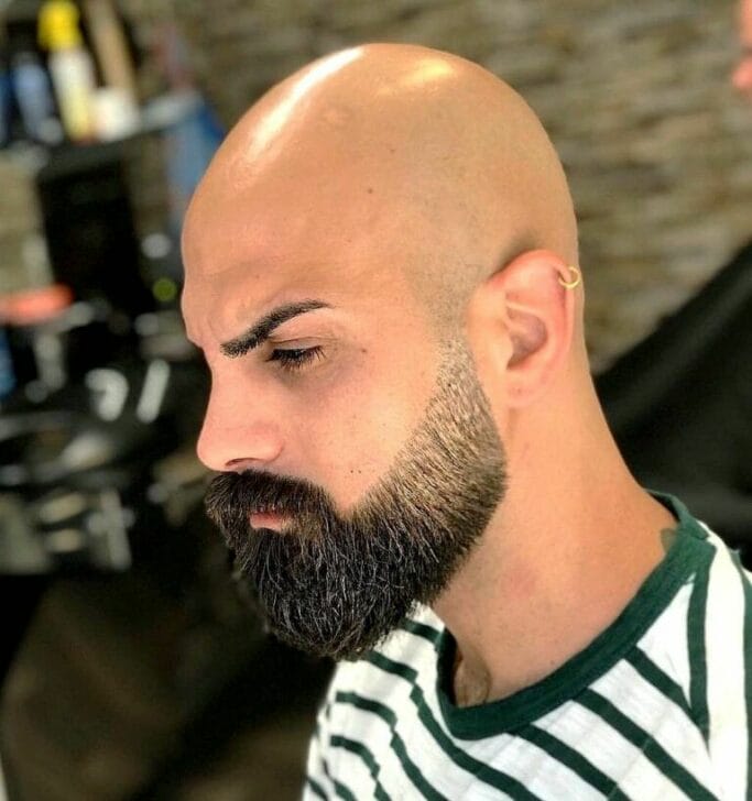 Bald haircut with beard style for oval head