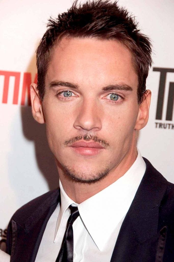 pencil mustache jonathan rhys meyers 683x1024 1 20 Hottest Pencil Mustache Styles to Try Today