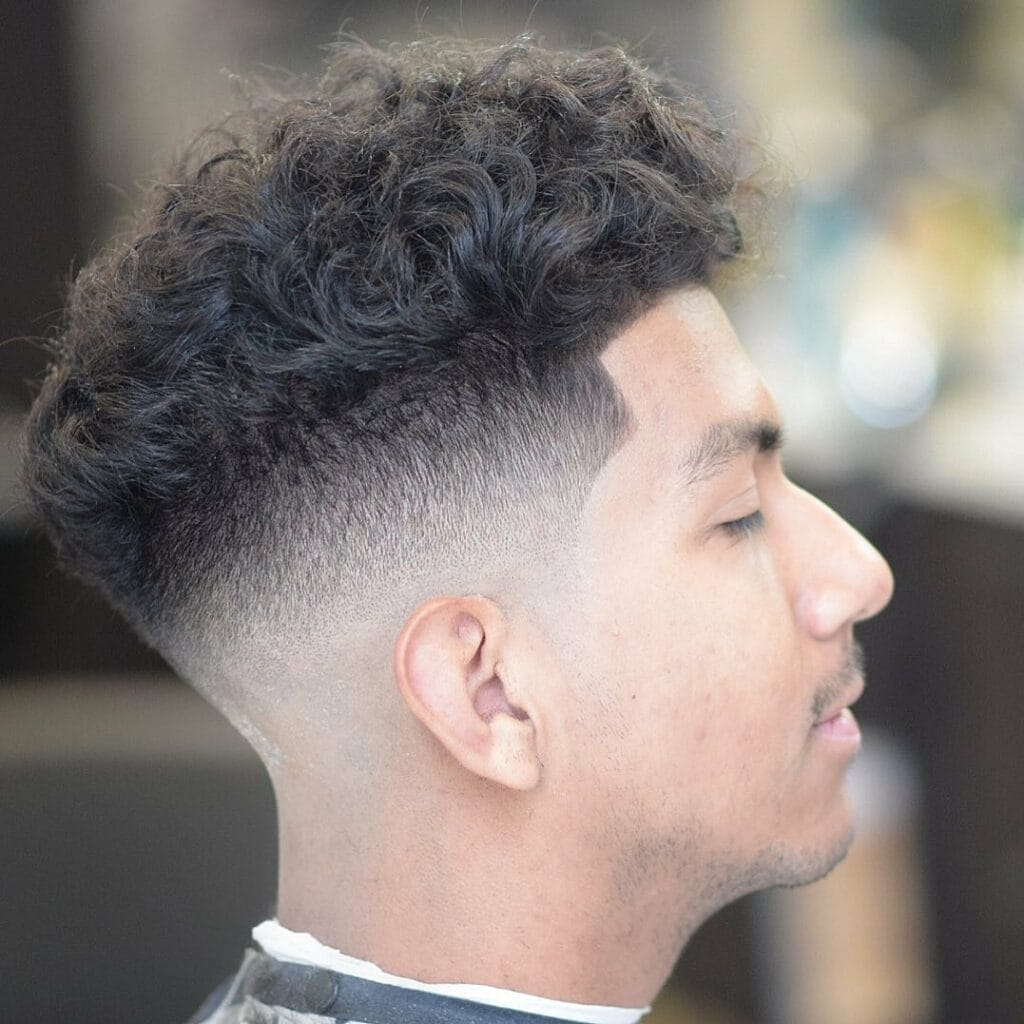 Mid Fade Haircuts That Will Make You Stand Out In a Crowd 9 Wavy mid fade haircut