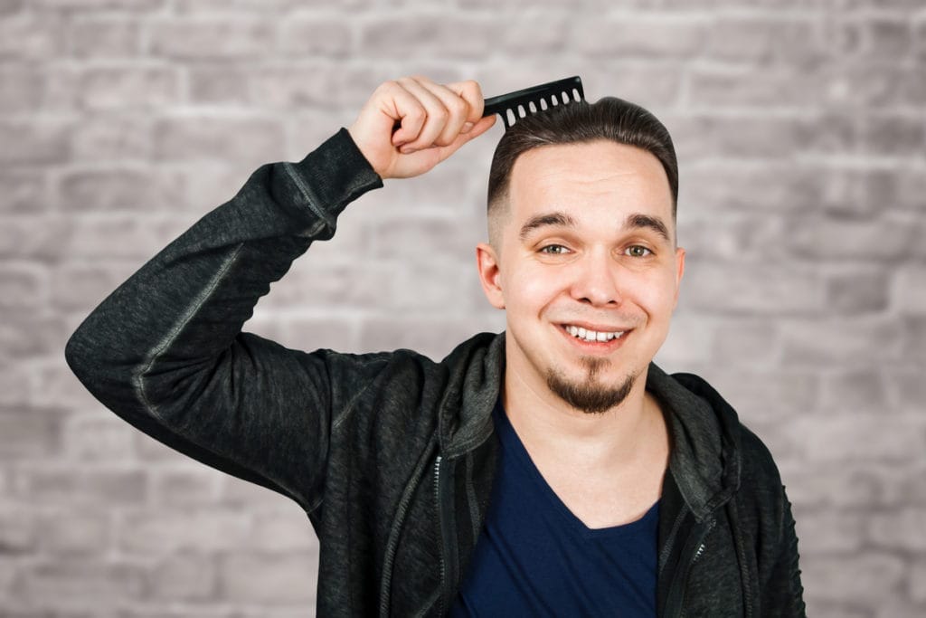 Mid Fade Haircuts That Will Make You Stand Out In a Crowd 28 Low Bald Taper Fade and Top Slicked Back Hair With Beard