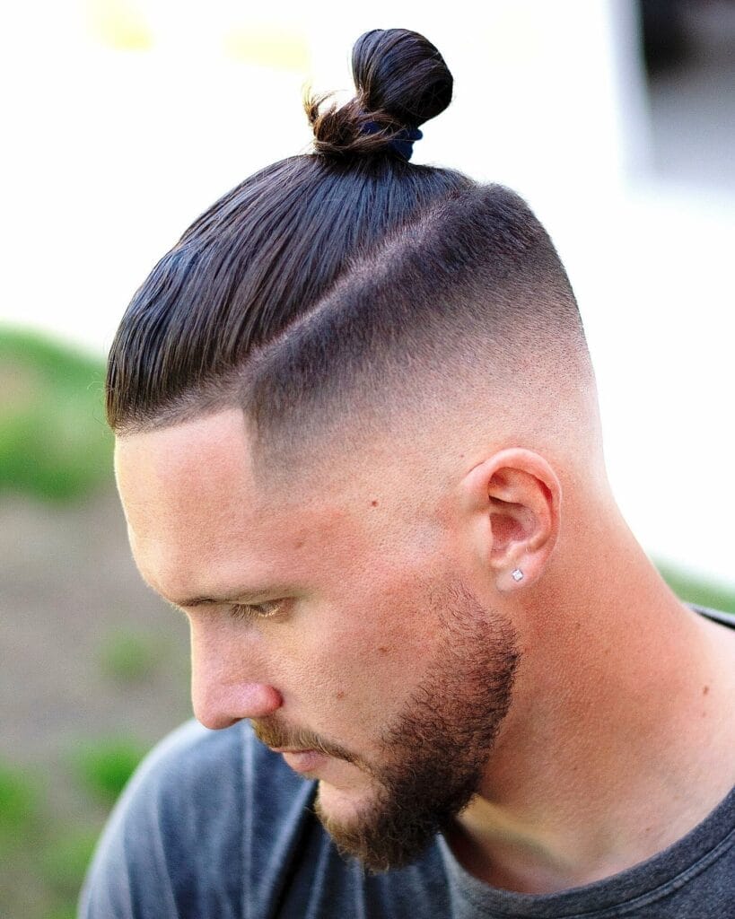 Discover the Hottest Trend in Men's Skin Fade Haircuts 36 Man Bun with Skin Fade