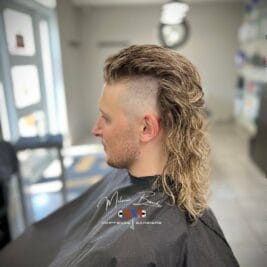 Timeless Mullet Haircut For A Daring Fashion Statement 8 Slick Back and Temple Fade Mullet Hairstyles