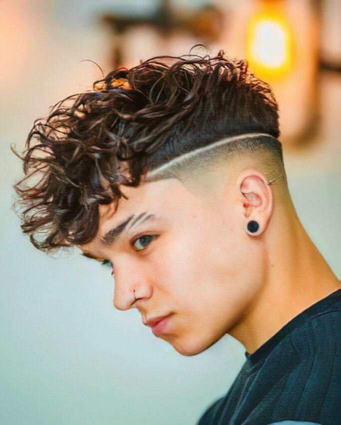 99 Men’s Haircuts That Will Turn Heads 23 Long wavy Men’s Haircuts