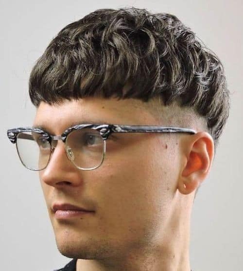 Curly Bangs with a Mid Fade