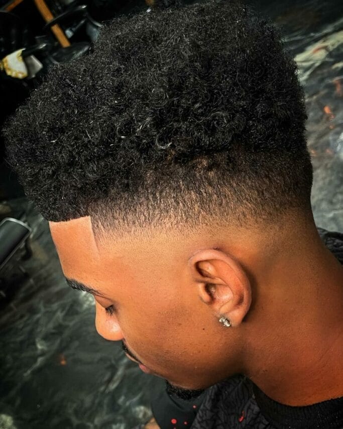 Unraveling the Charm: Curly Hairstyles for Men 76 Curly Taper Fade