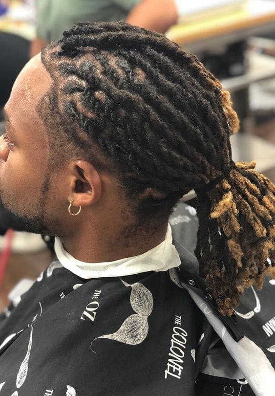 Locks That Rock: 25 Long Hairstyles for Men to Turn Heads 11 The Twisted Ponytail