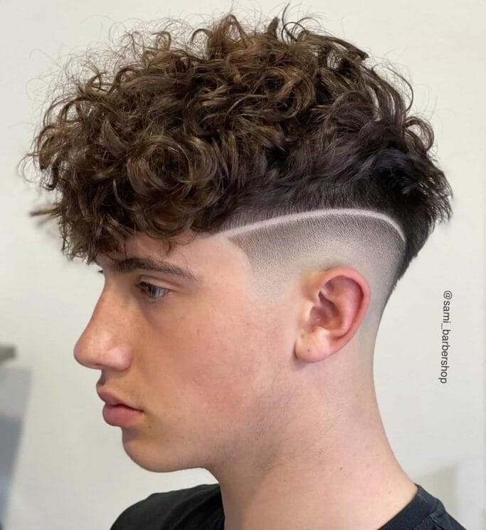99 Men’s Haircuts That Will Turn Heads 54 faux hawk wavy Men’s Haircuts