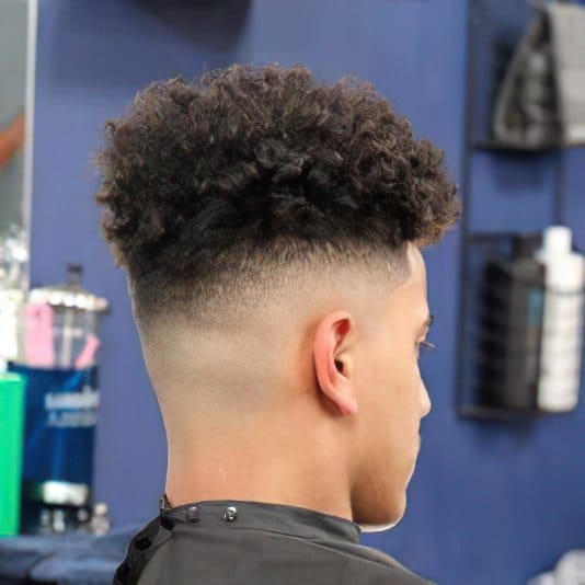 high top fade haircut curly 1 High Fade Haircut: A Trendy and Versatile Style for Men